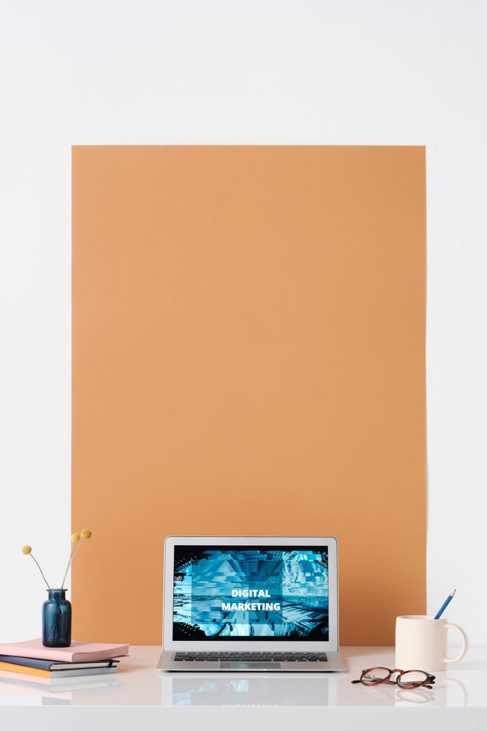 our-values Modern workspace featuring a laptop with a digital marketing screen, ideal for business and technology themes.